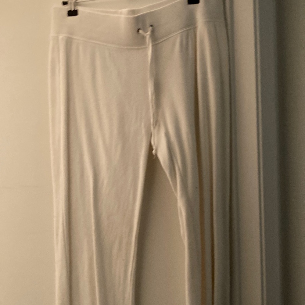 BeBe White LG Pants extremely wrinkled. Excellent condition.
